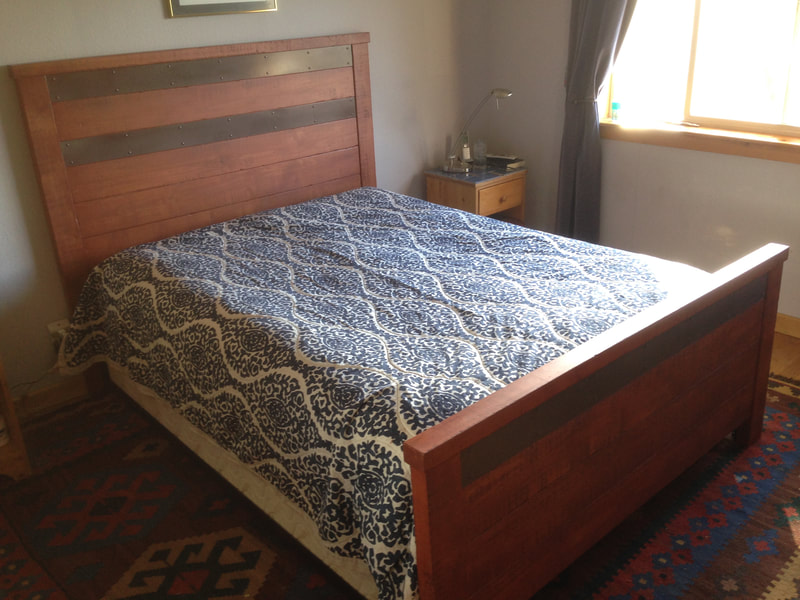 Custom bed headboard, recycled wood and wine barrel metal strap