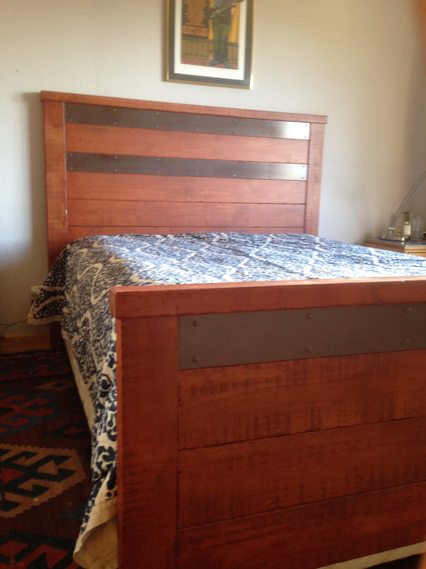 Custom bed headboard, recycled wood and wine barrel metal strap